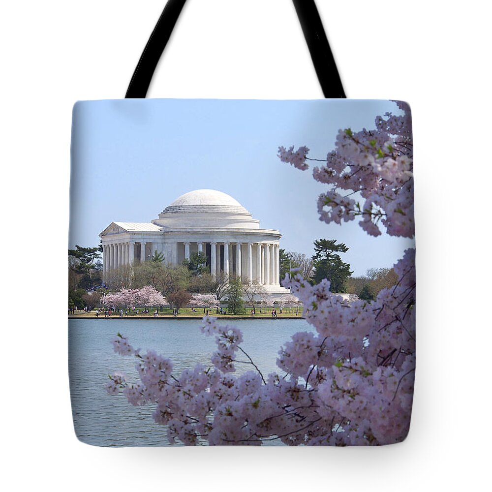 Landmarks Tote Bag featuring the photograph Jefferson Memorial - Cherry Blossoms by Mike McGlothlen