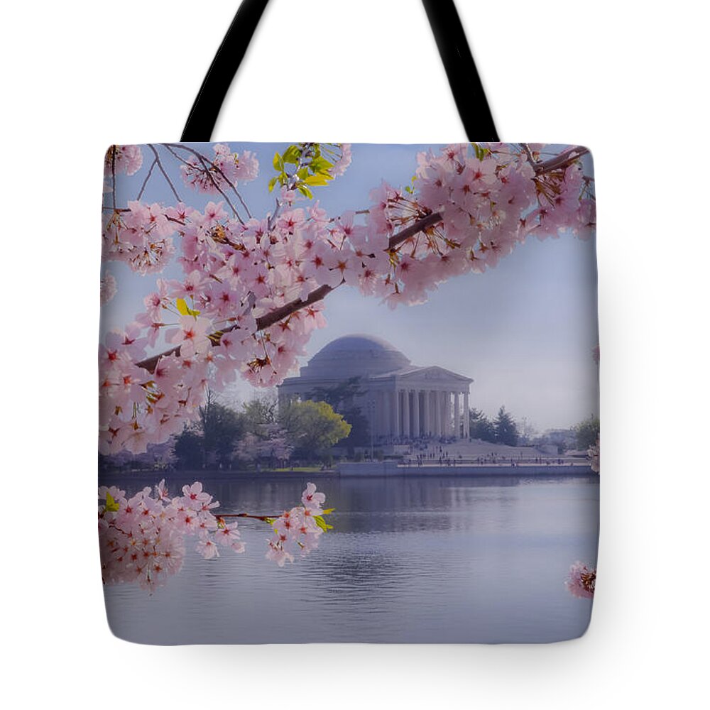 2012 Centennial Celebration Tote Bag featuring the photograph Jefferson Memorial through the Blossoms by Jeff at JSJ Photography