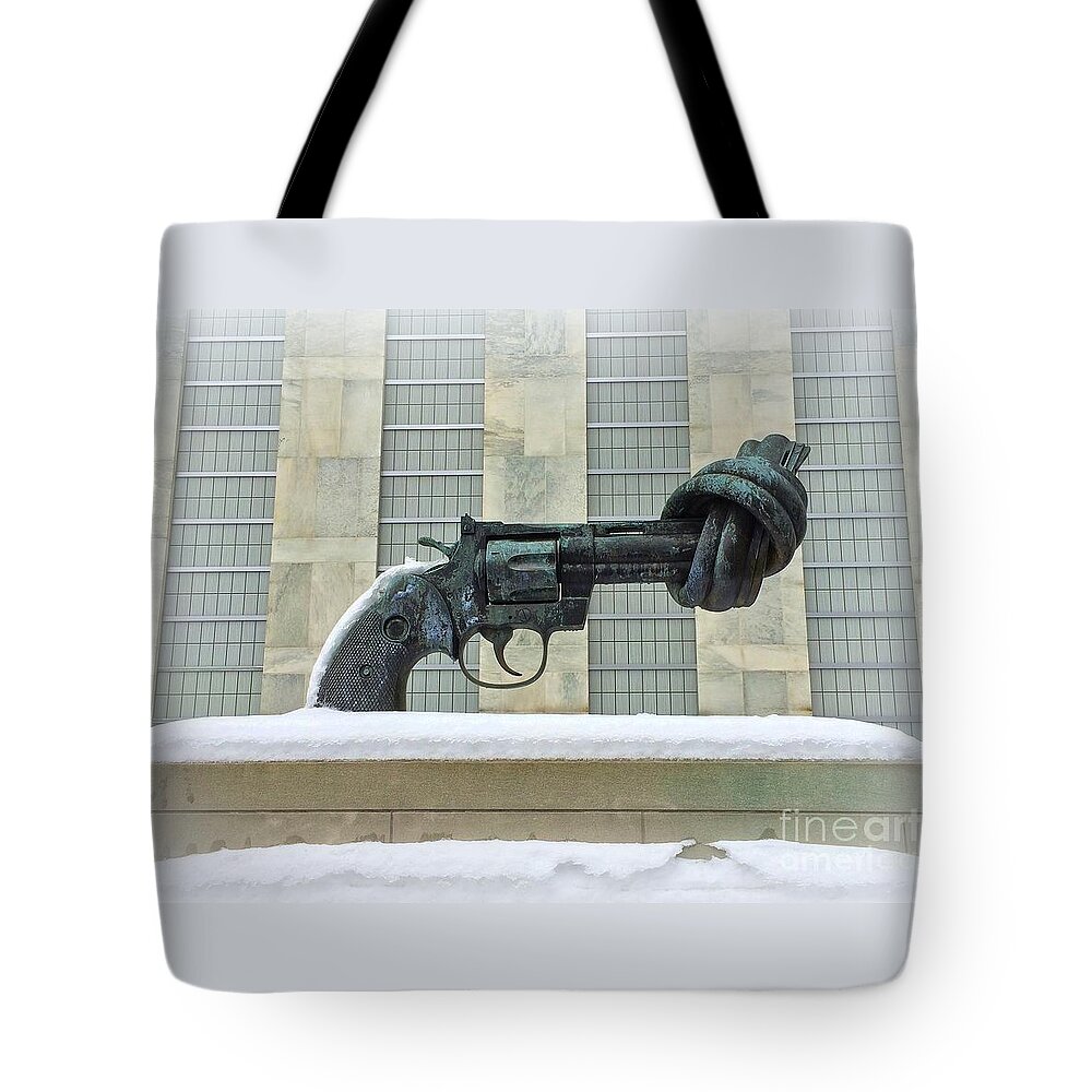 United Nations Tote Bag featuring the photograph Knotted Gun Sculpture at the United Nations by Miriam Danar
