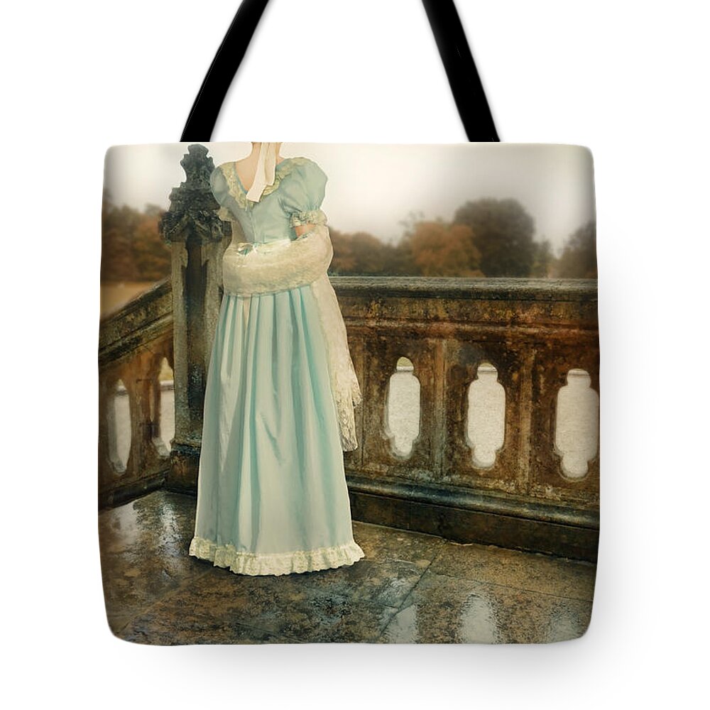 Woman Tote Bag featuring the photograph Lady on a Veranda by Jill Battaglia