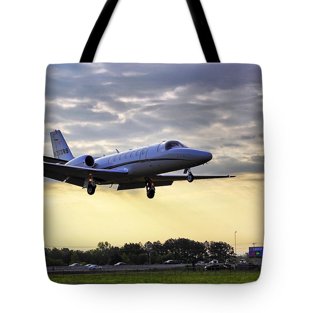 Airplane Tote Bag featuring the photograph Landing at Sunrise by Jason Politte