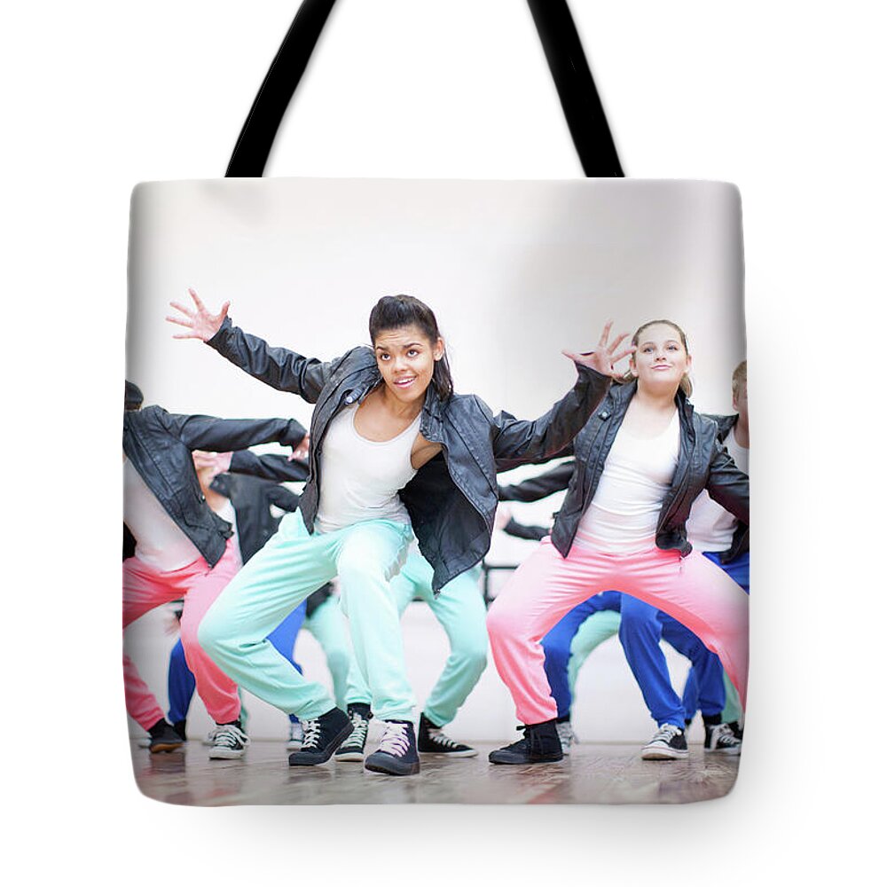 People Tote Bag featuring the photograph Large Group Of Teenagers Dancing In by Zero Creatives