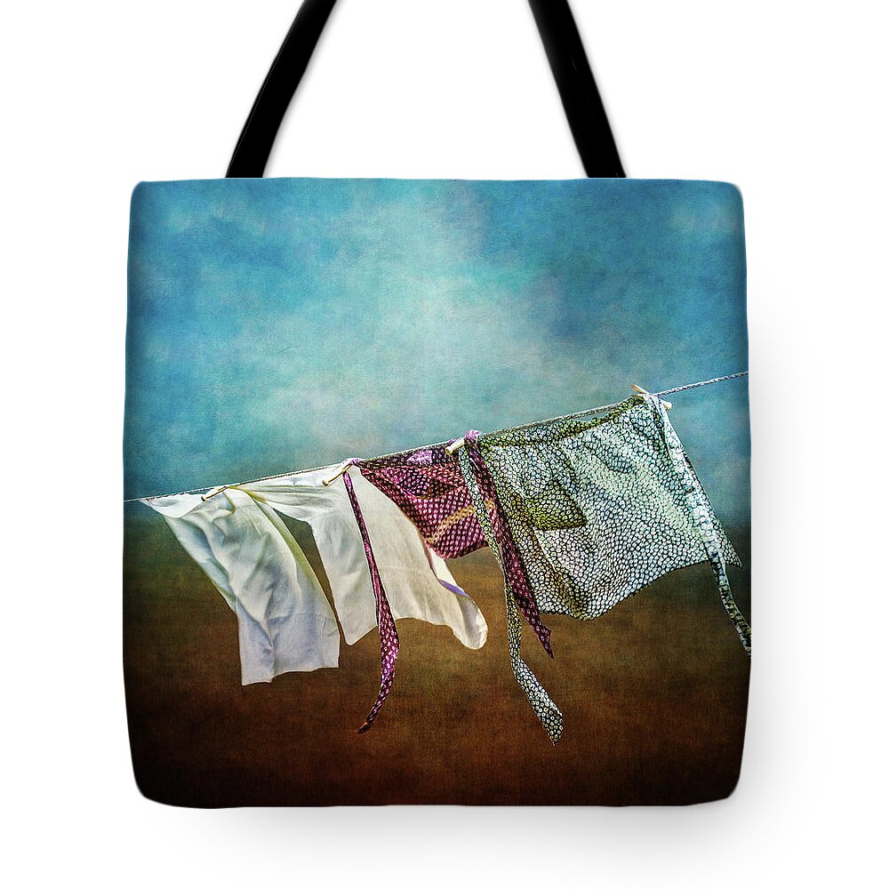 Wind Tote Bag featuring the photograph Laundry Drying On The Clothesline by Melinda Moore