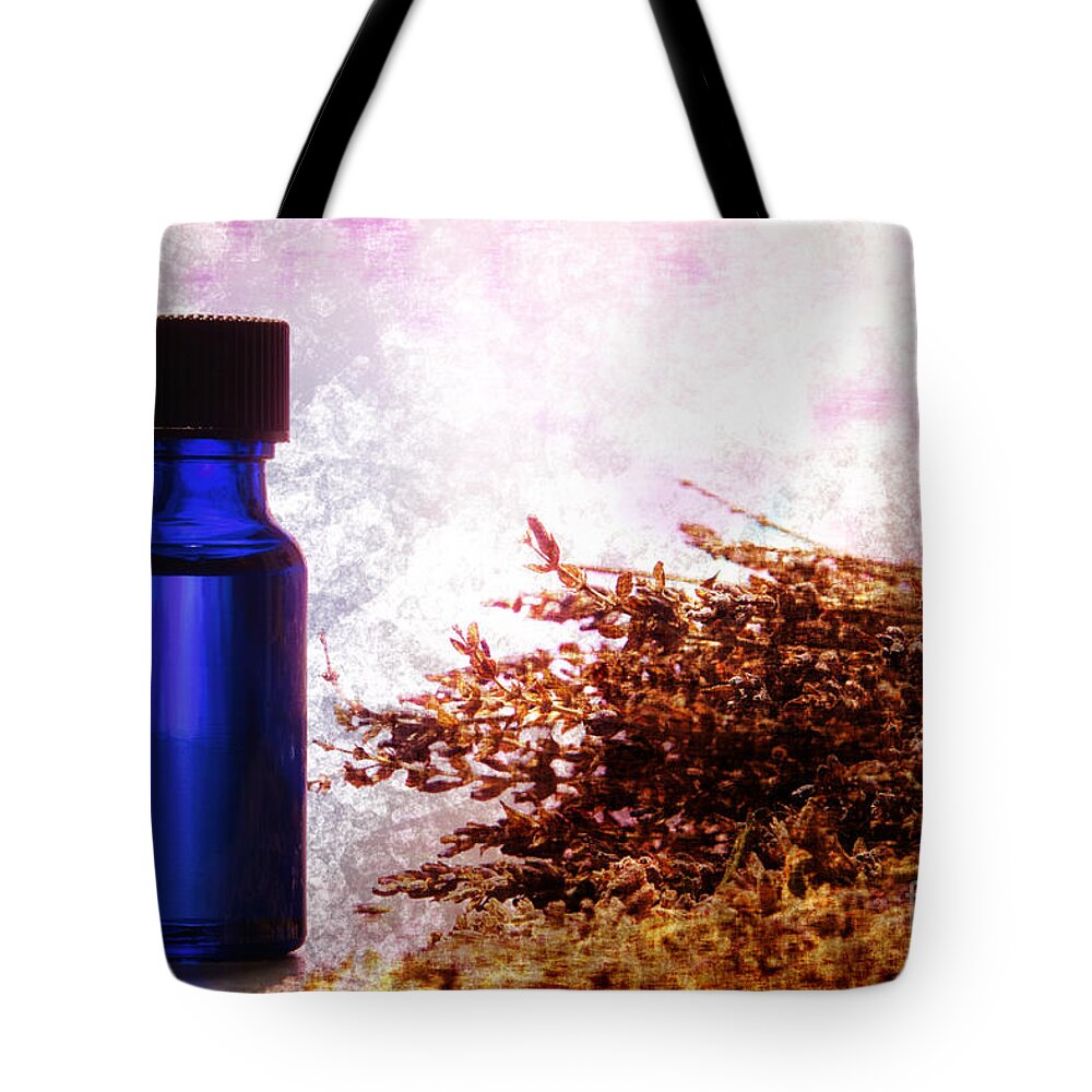 Aromatherapy Tote Bag featuring the photograph Lavender Essential Oil Bottle by Olivier Le Queinec
