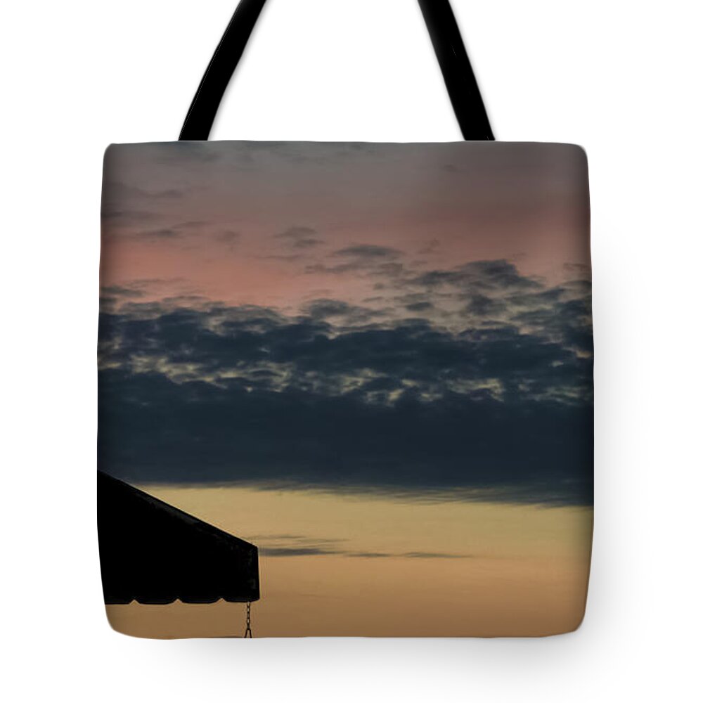Leave The Light On Tote Bag featuring the photograph Leave The Light On by Charlie Cliques