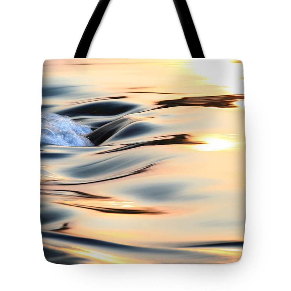Scenics Tote Bag featuring the photograph Light reflecting on flowing water by Bihaibo
