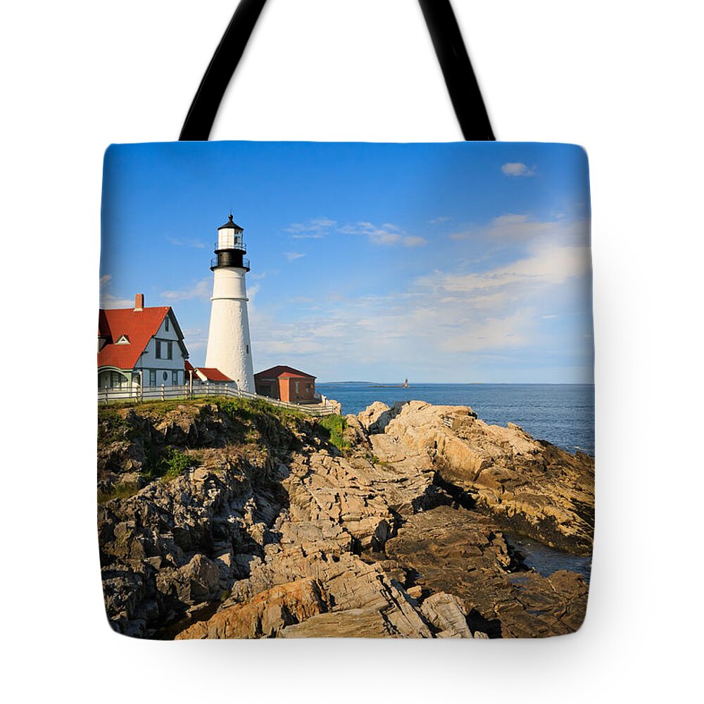 Lighthouse Tote Bag featuring the photograph Lighthouse in the sun by Sue Leonard