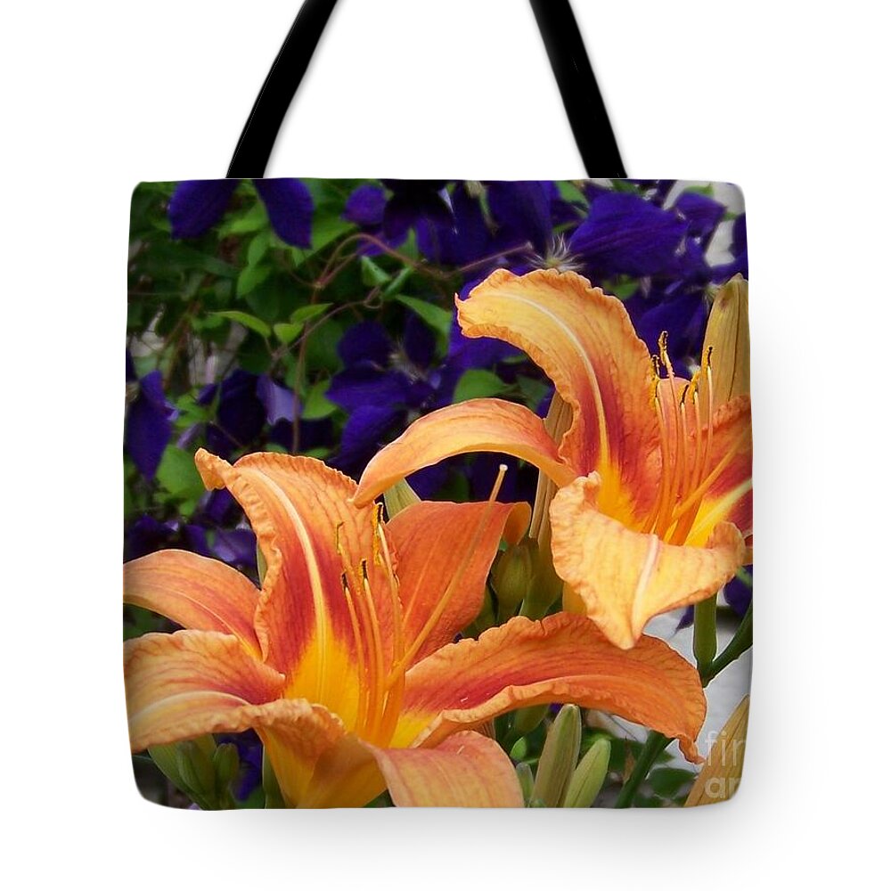 Lilies Tote Bag featuring the photograph Lilies and Clematis by Jackie Mueller-Jones