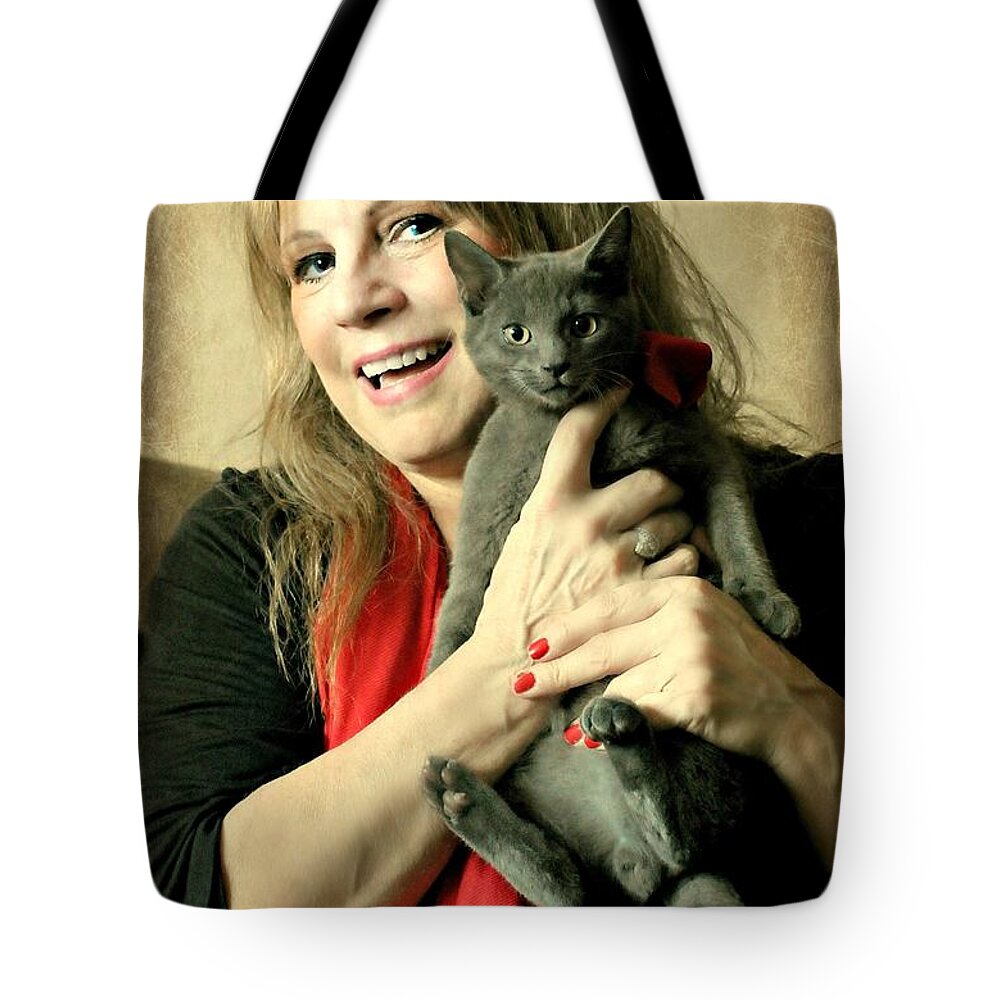 Lady And Her Cat Tote Bag featuring the photograph Love Abounds by Diana Angstadt
