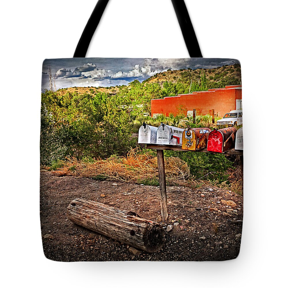 Mailboxes Tote Bag featuring the photograph Mailboxes and a Log by Madeline Ellis