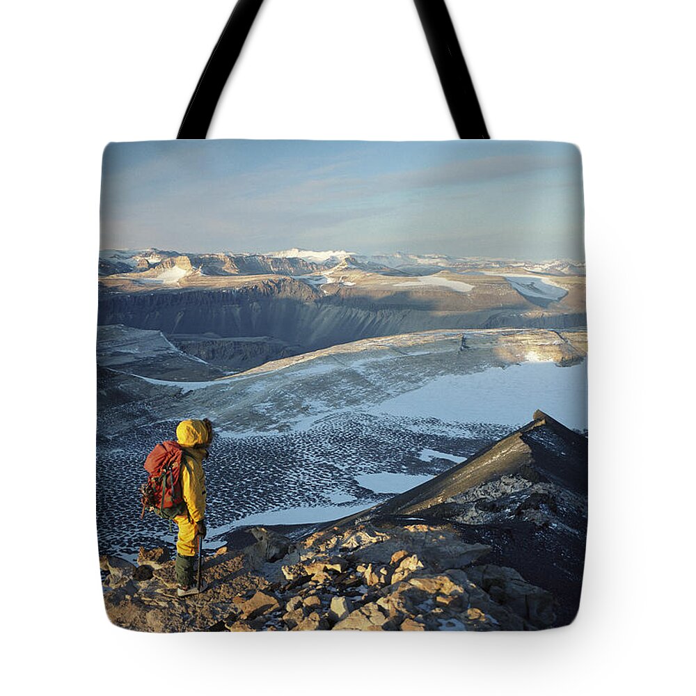Feb0514 Tote Bag featuring the photograph Man Overlooking Olympus Range Antarctica by Colin Monteath