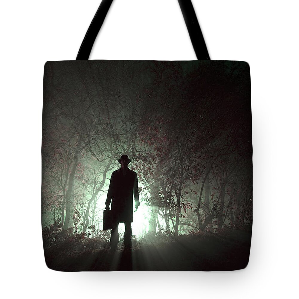 Man Tote Bag featuring the photograph Man Waiting In Fog With Case by Lee Avison