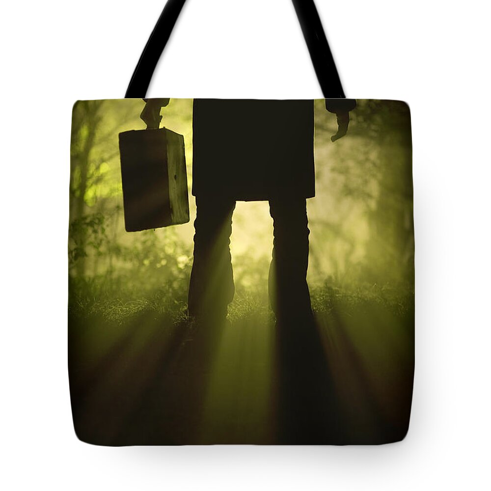 Man Tote Bag featuring the photograph Man With Case In Fog by Lee Avison