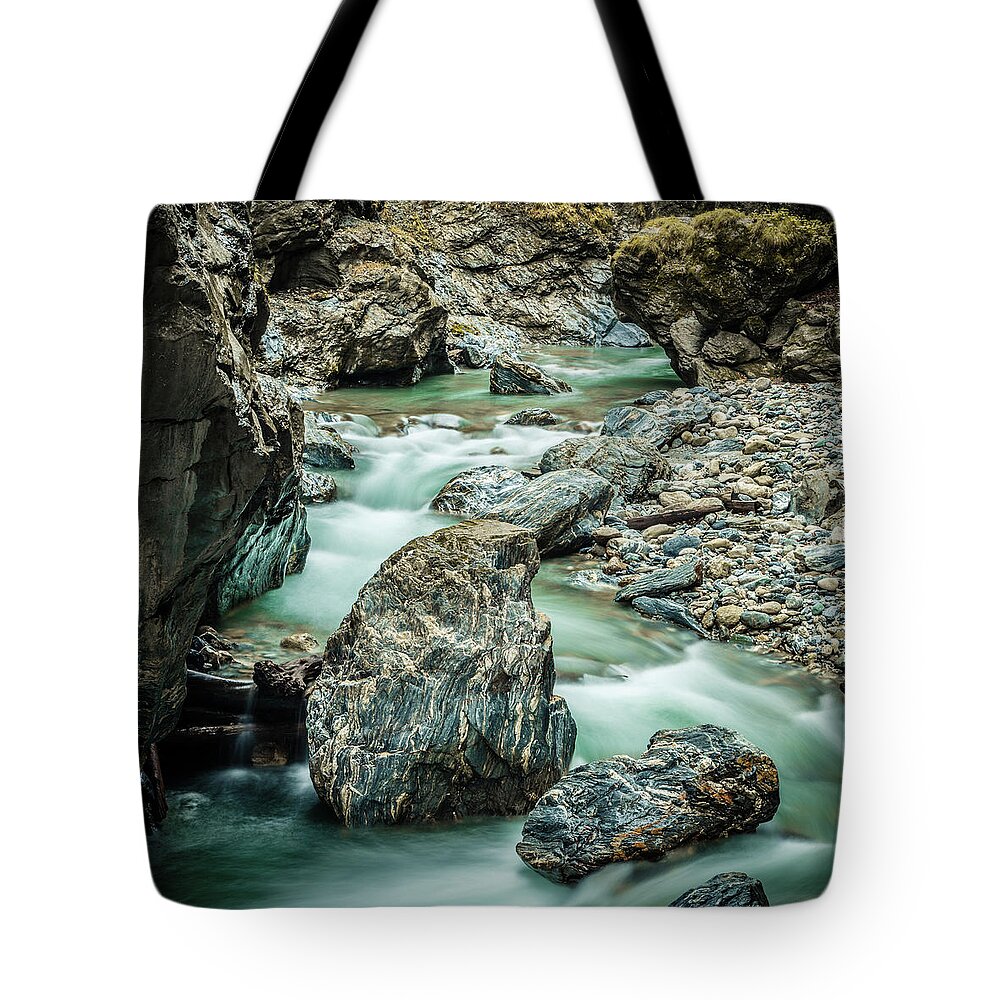 Scenics Tote Bag featuring the photograph Marble Stones In A Mountain River by 5ugarless