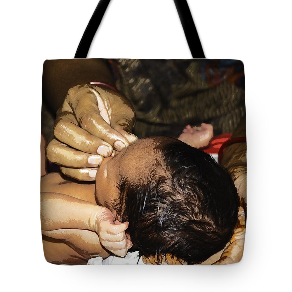 Masseuse doing light massage face of a 5 day old Indian baby Tote Bag by Ashish Agarwal - Fine Art America
