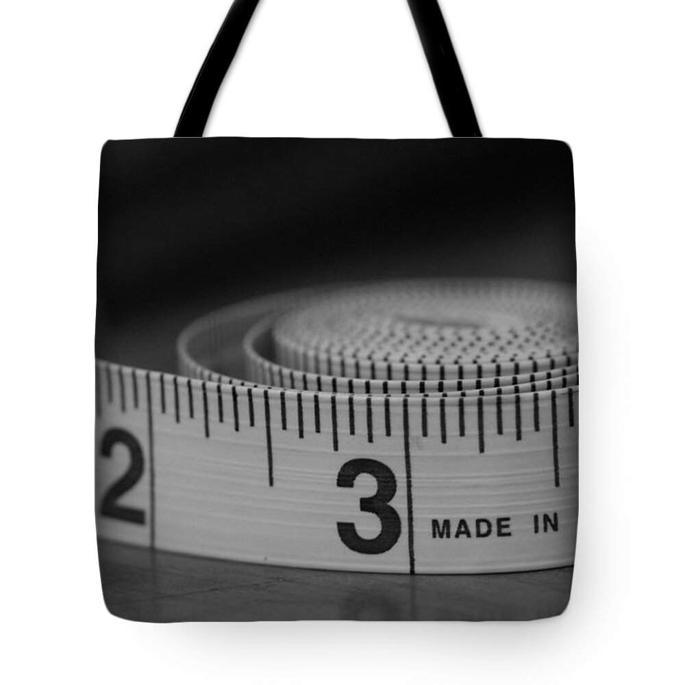 Tape Measure Tote Bag featuring the photograph Measuring Up by Holden The Moment