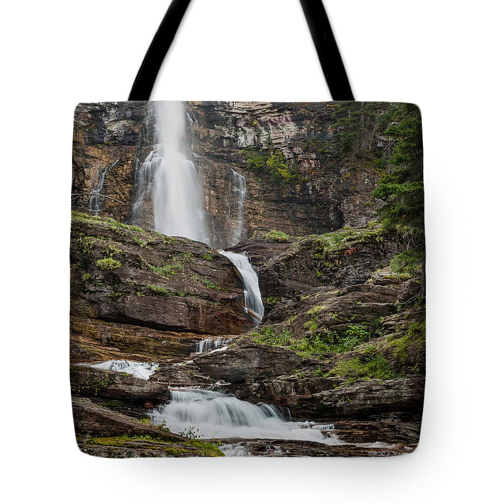 Glacier National Park Tote Bag featuring the photograph Mighty Virginia Falls by Greg Nyquist