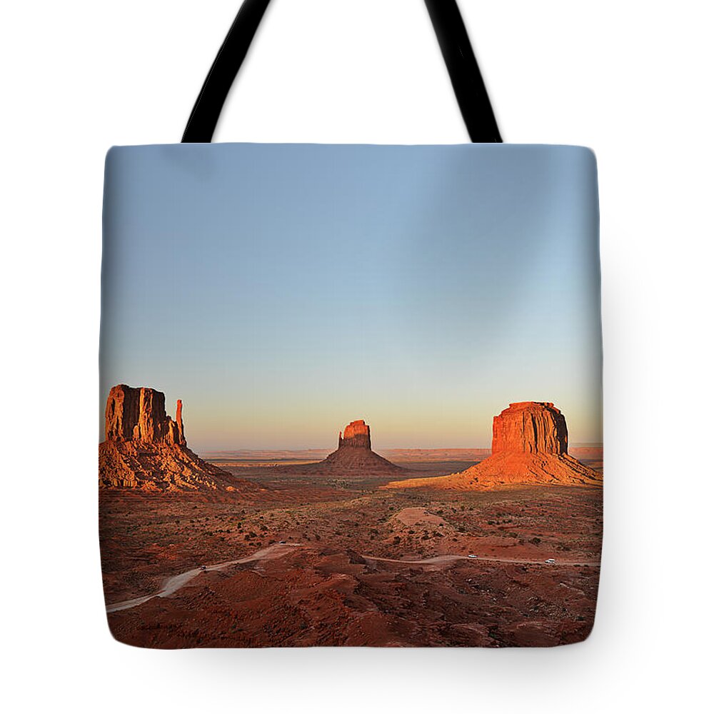 Monument Tote Bag featuring the photograph Mittens and Merrick Butte Monument Valley by Alexandra Till