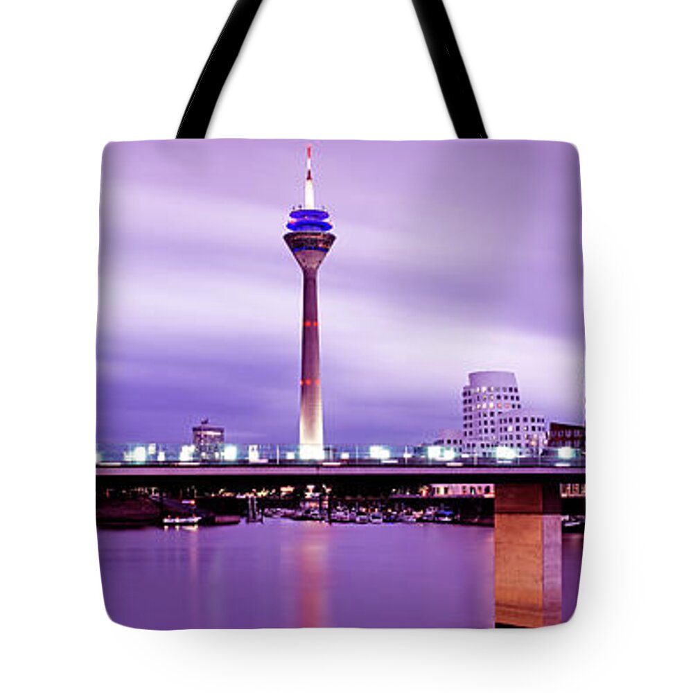 Panoramic Tote Bag featuring the photograph Modern Buildings At Dusk by Murat Taner