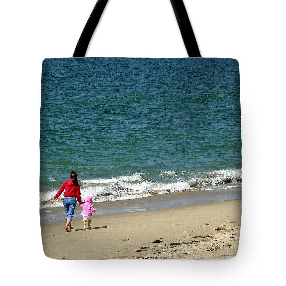 Mom And Toddler Walking Along The Beach Tote Bag featuring the photograph Mommy Daughter Beach Time by Jeff Lowe