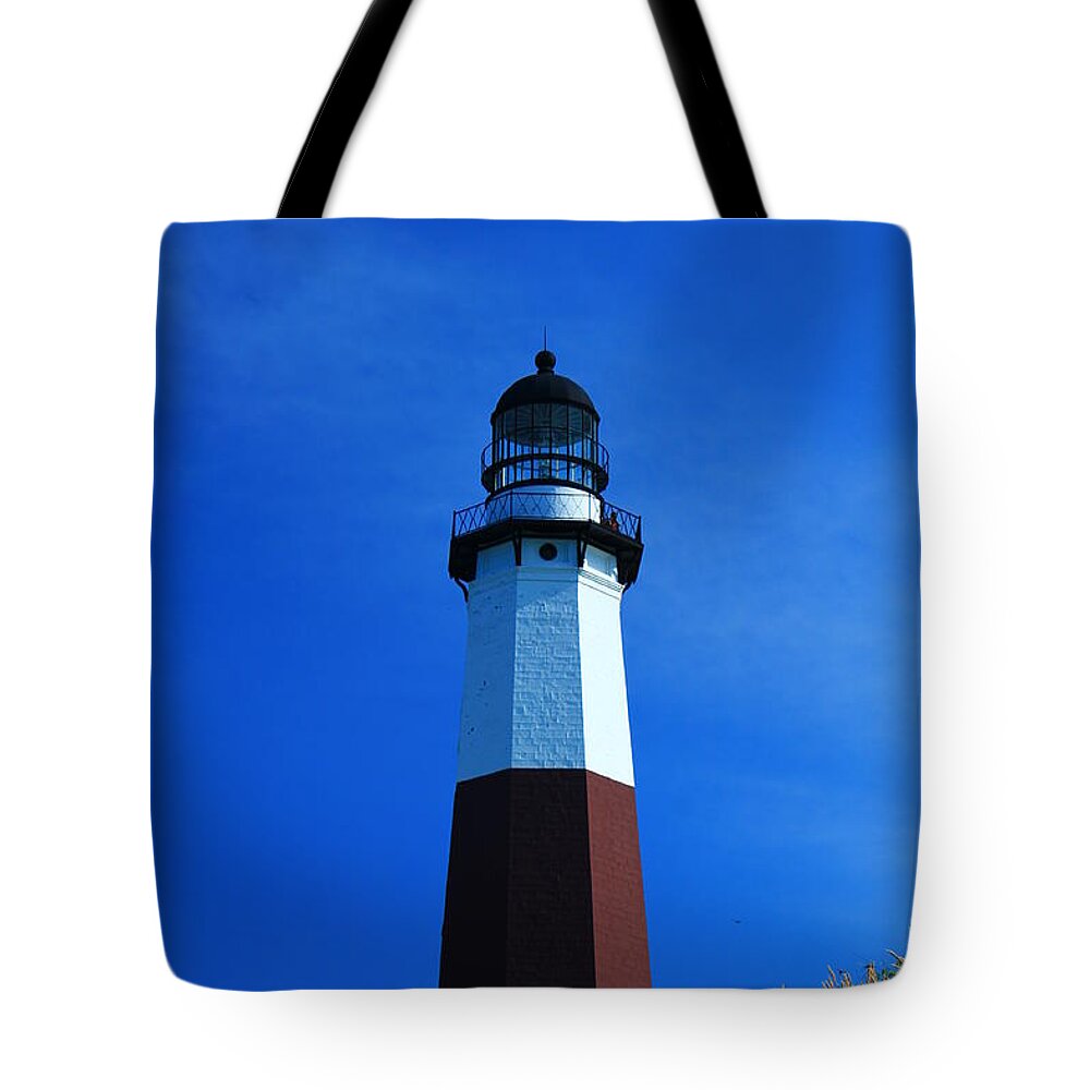 Montauk Tote Bag featuring the photograph Montauk Lighthouse by Catie Canetti