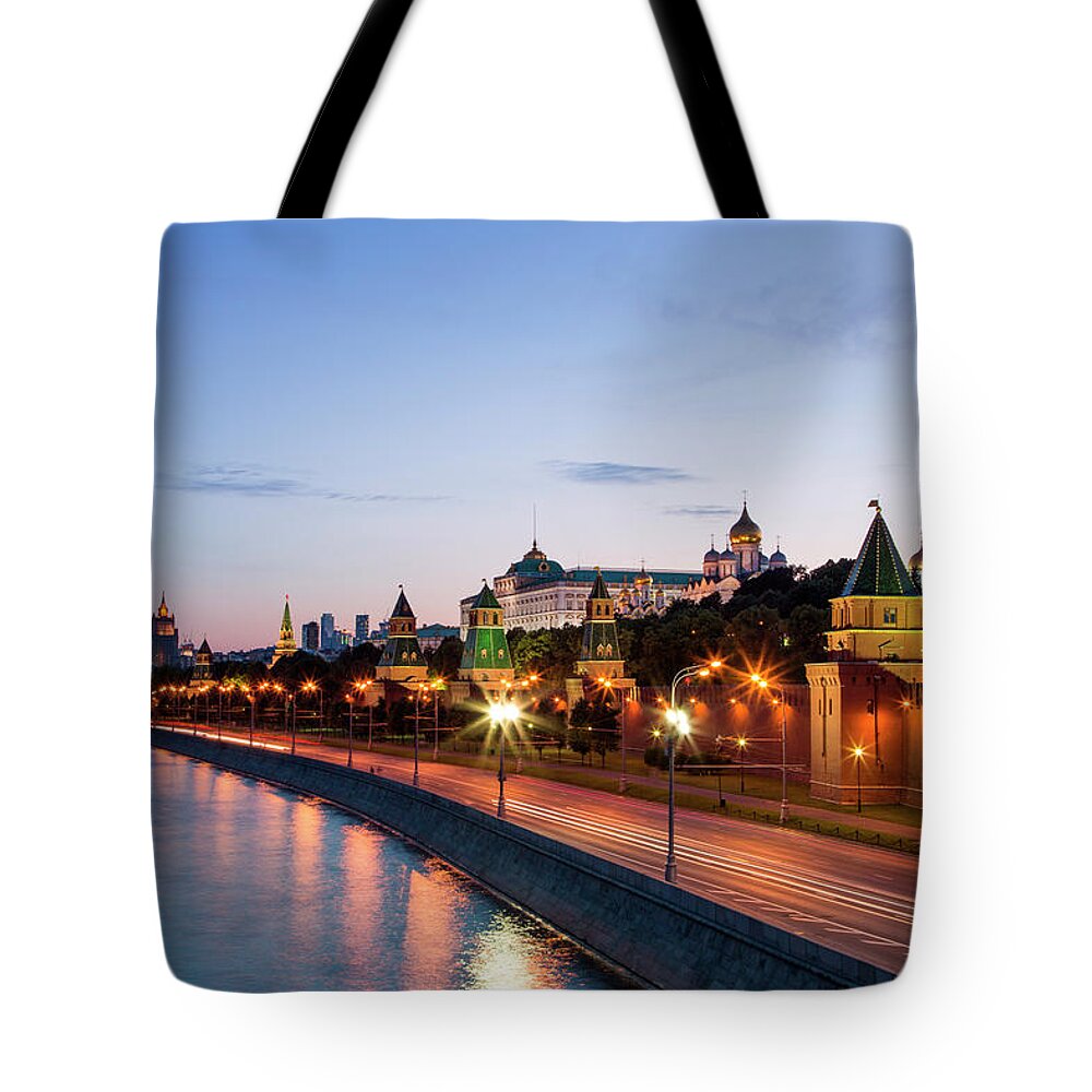 Tranquility Tote Bag featuring the photograph Moskva River And Kremlin Buildings At by Holger Leue