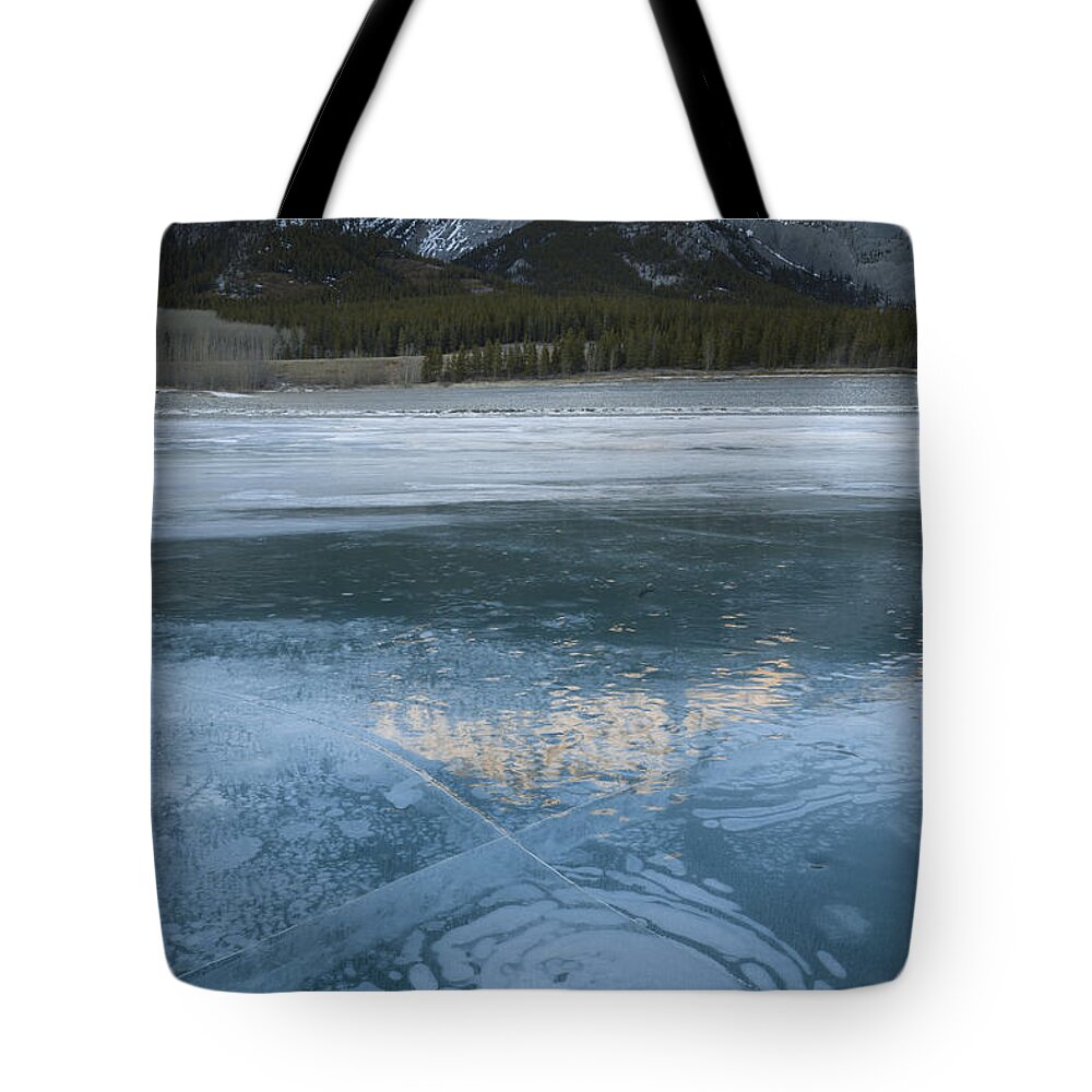 Alberta Tote Bag featuring the photograph Mt. Abraham And Ice On Abraham Lake by John Shaw