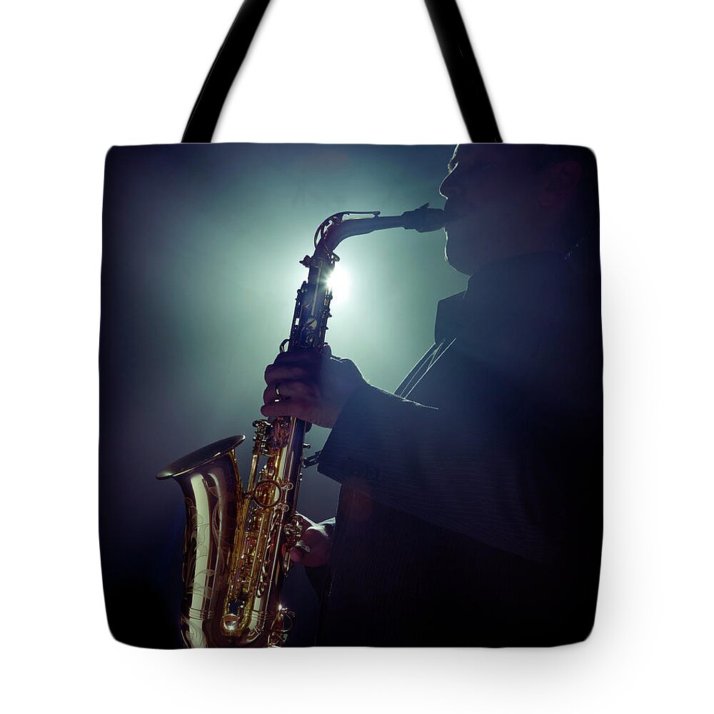 People Tote Bag featuring the photograph Musician Playing Saxophone by Tooga