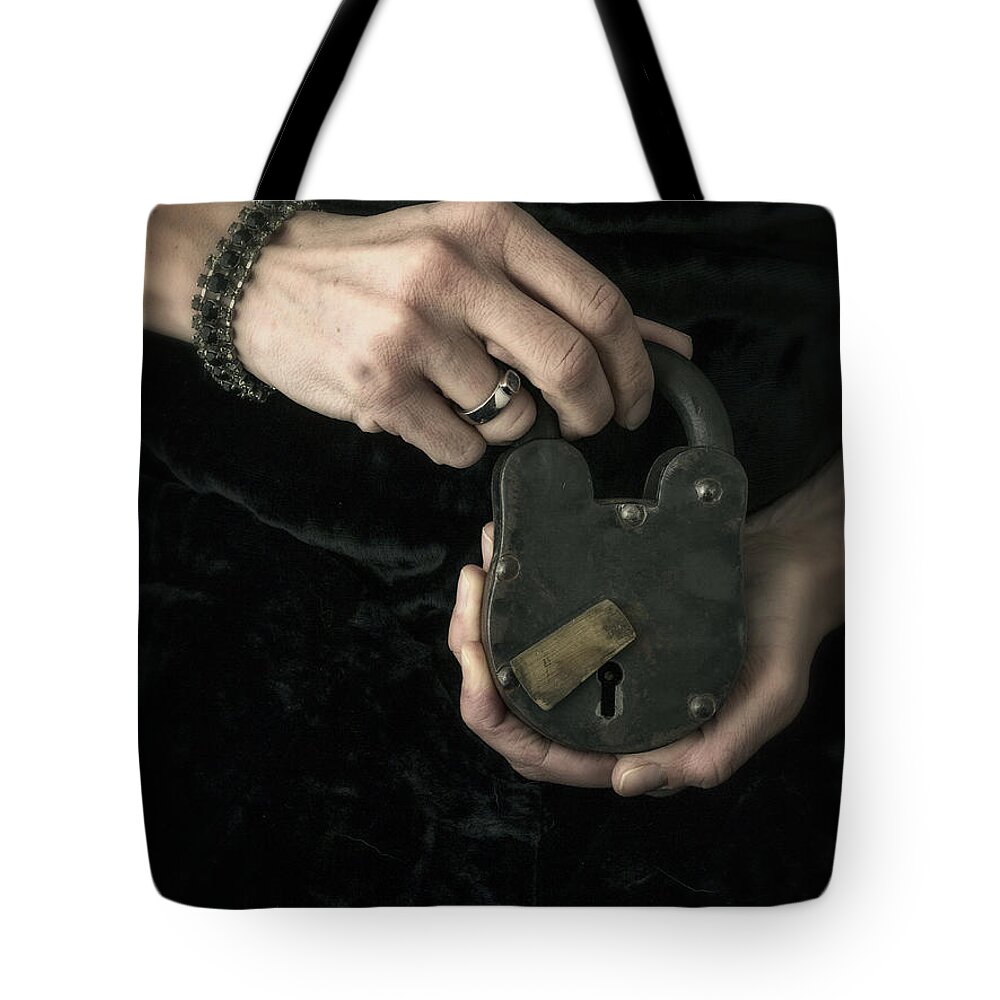 Mystery Tote Bag featuring the photograph Mysterious Woman with Lock by Edward Fielding