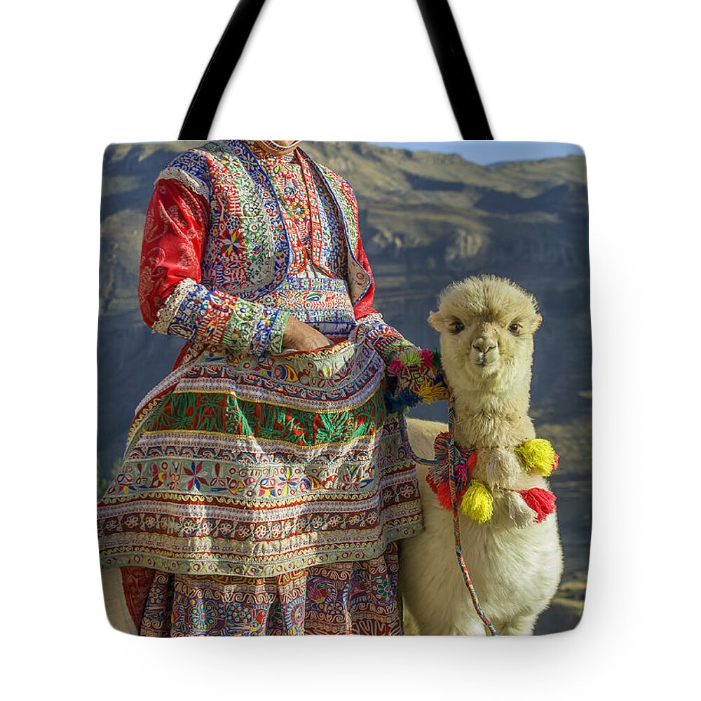 Baby Tote Bag featuring the photograph Native Peruvian woman with baby alpaca by Patricia Hofmeester