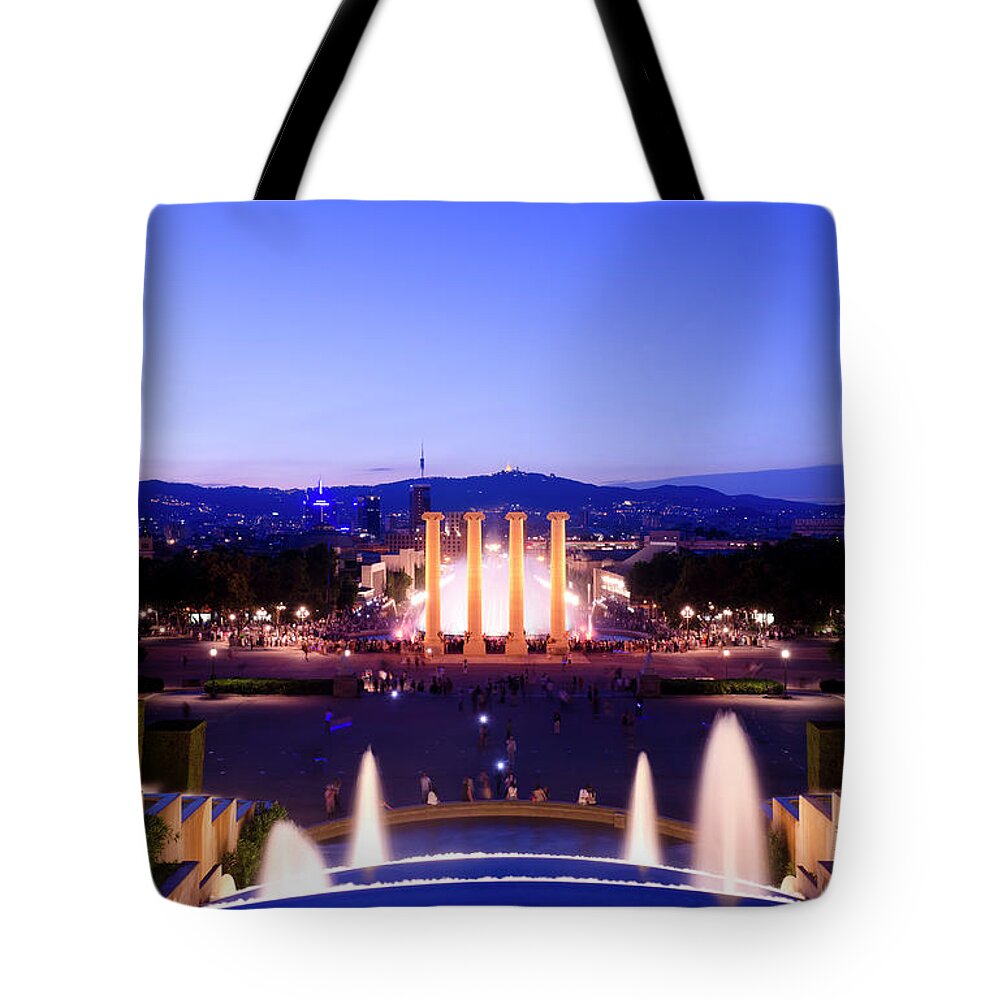 Crowd Tote Bag featuring the photograph Night Shot Of The Magic Fountain by Dynasoar
