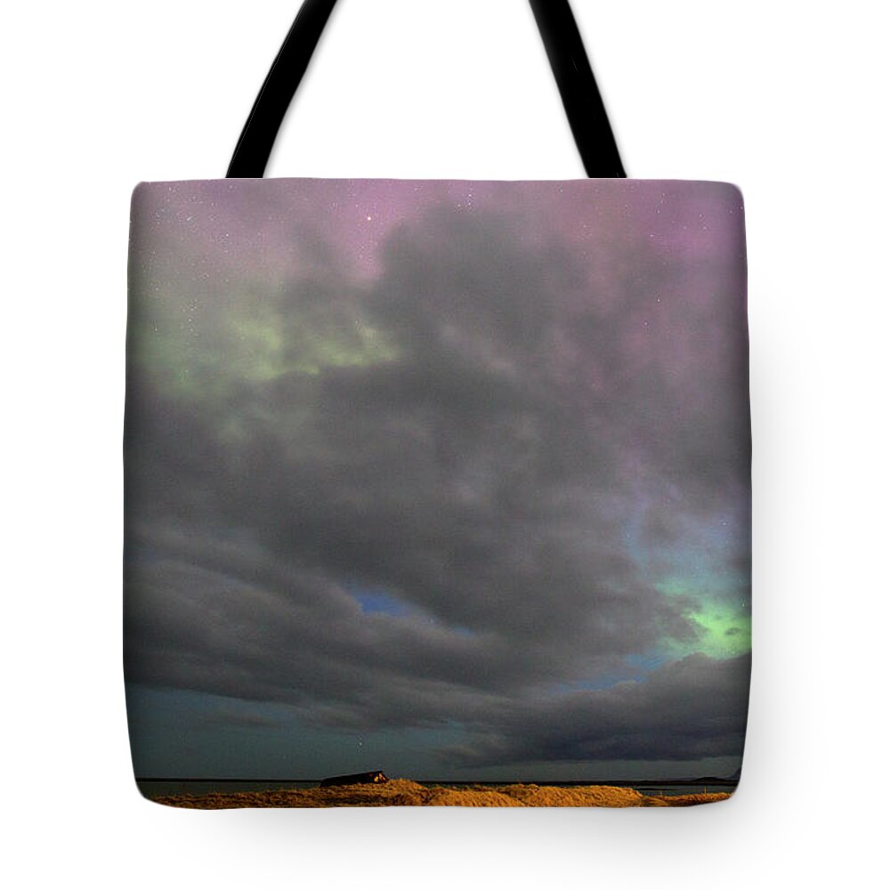 Scenics Tote Bag featuring the photograph Northern Lights In Iceland by Richard Mcmanus