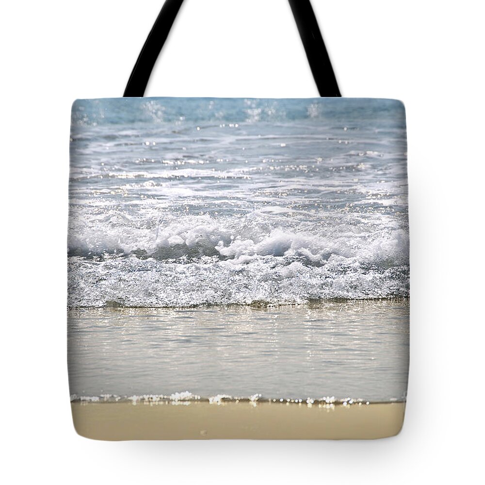 Water Tote Bag featuring the photograph Ocean shore with sparkling waves by Elena Elisseeva