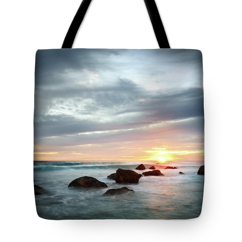 Water's Edge Tote Bag featuring the photograph Ocean Sunset by Piskunov