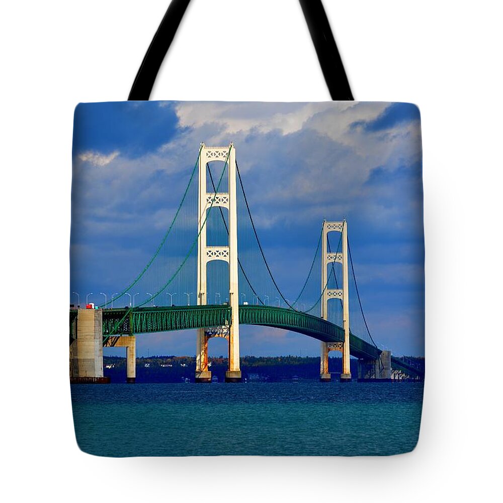 Michigan Tote Bag featuring the photograph October Sky Mackinac Bridge by Keith Stokes