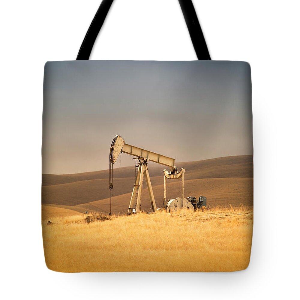 Air Pollution Tote Bag featuring the photograph Oil Industry Well Pumps by Pgiam