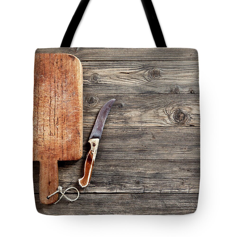 Empty Tote Bag featuring the photograph Old Cutting Board And Knife by Barcin