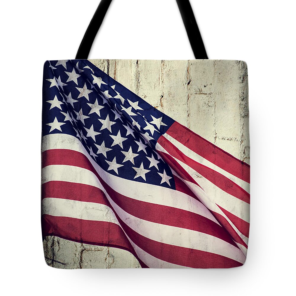 American Flag Tote Bag featuring the photograph Old Flag by Paulo Goncalves