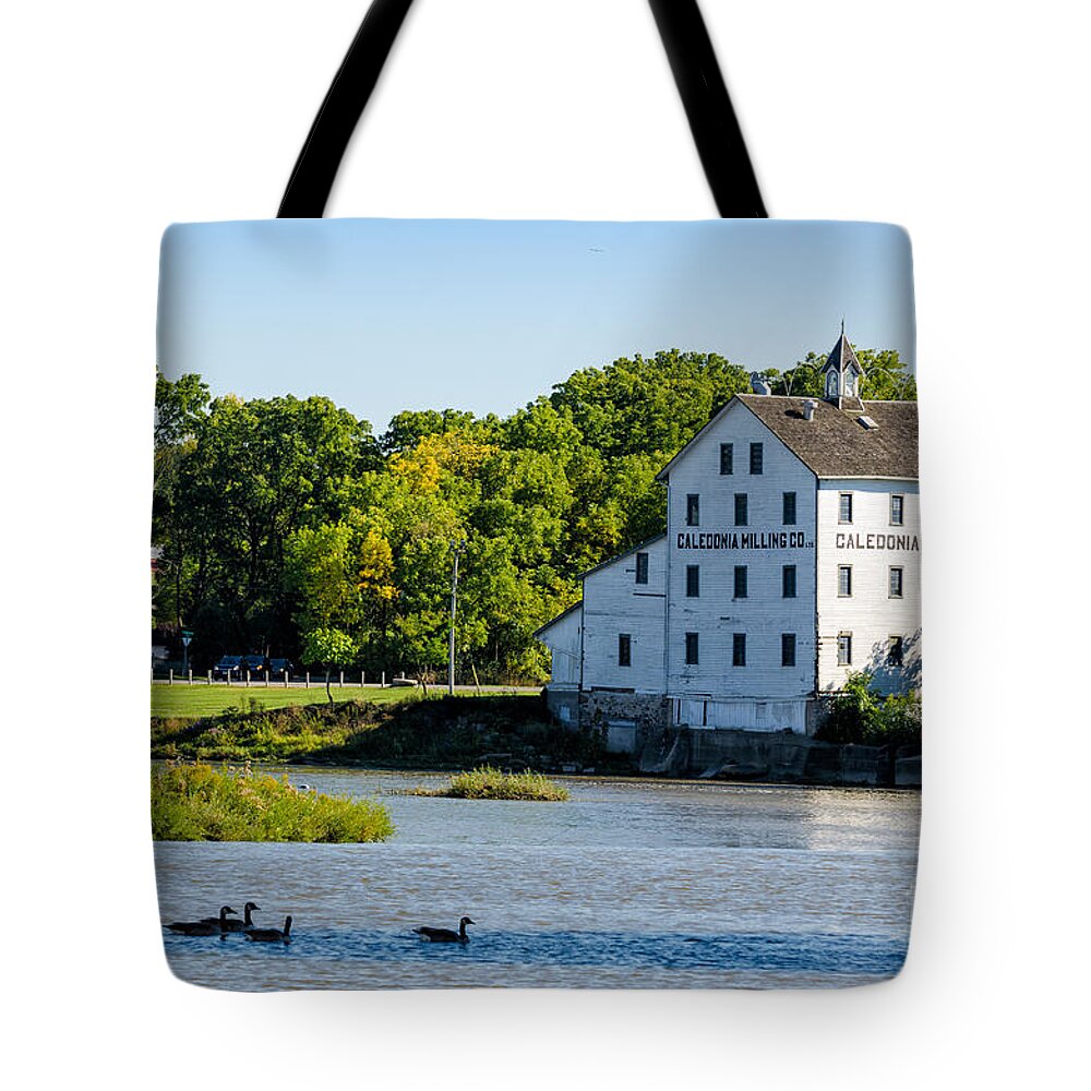 Old Tote Bag featuring the photograph Old Mill on Grand River in Caledonia in Ontario by Les Palenik