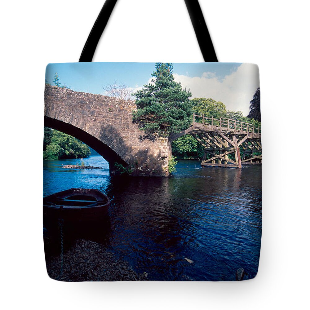Loch Ness Tote Bag featuring the photograph Old River Oich bridge by Riccardo Mottola