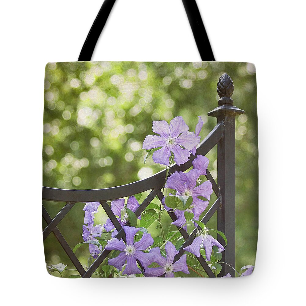 Purple Flower Tote Bag featuring the photograph On The Fence by Kim Hojnacki