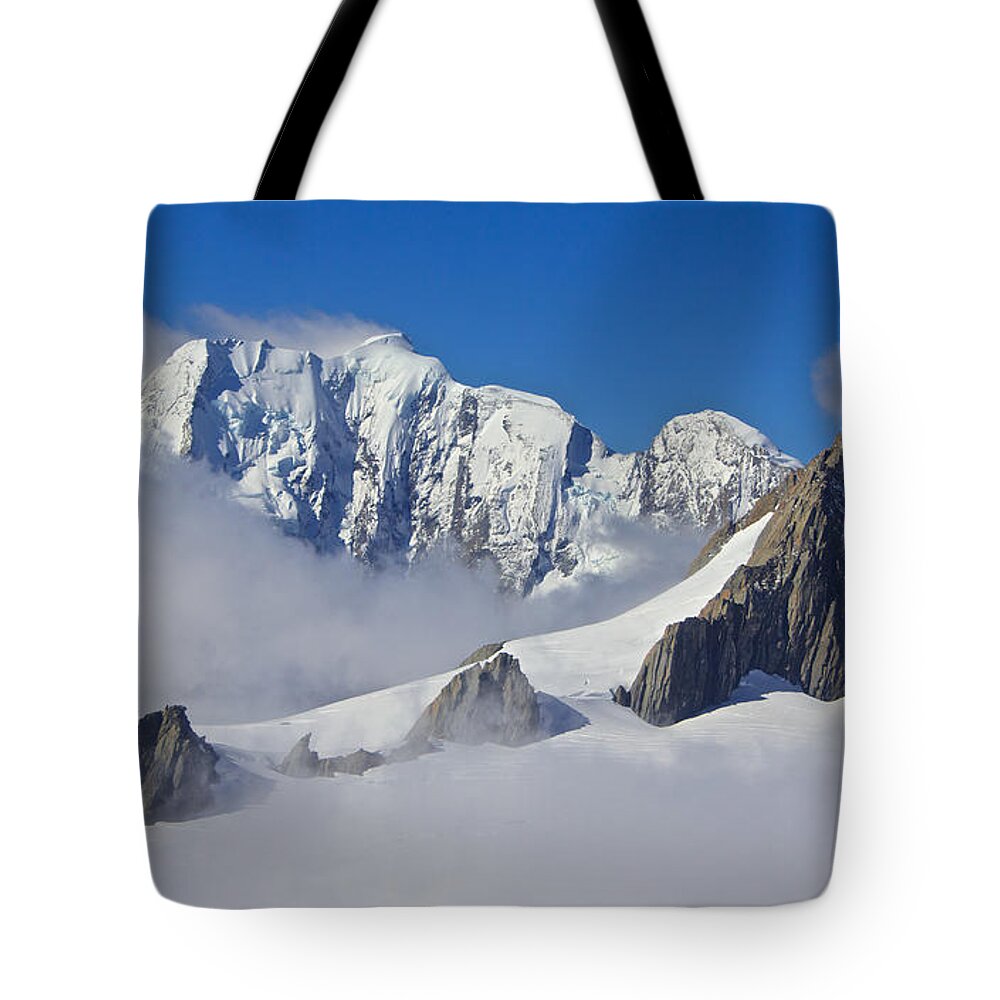 Mountain Peaks Tote Bag featuring the photograph On Top of the World, New Zealand by Venetia Featherstone-Witty