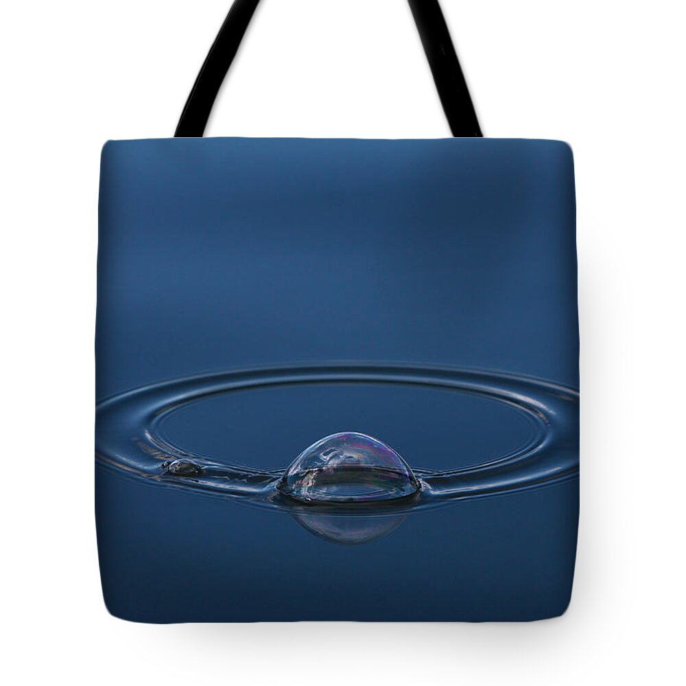 Orbit Tote Bag featuring the photograph Orbit by Cathie Douglas