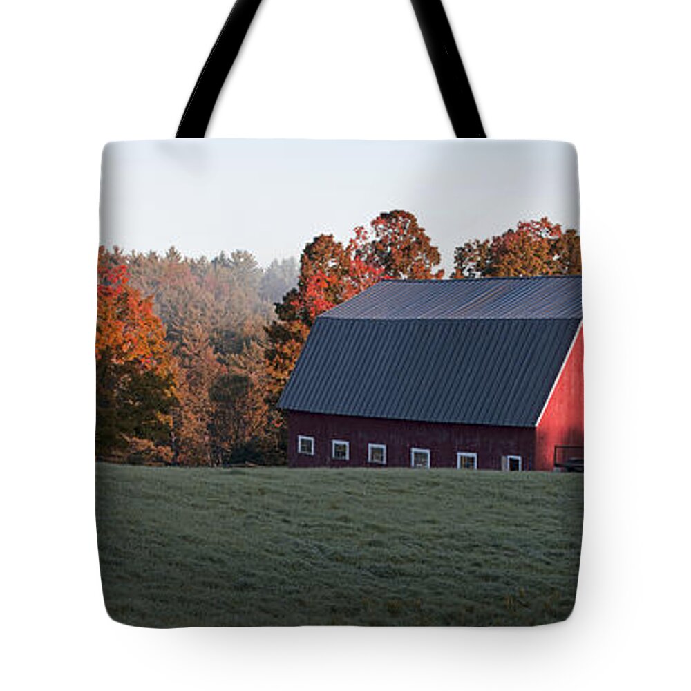 Foliage Tote Bag featuring the photograph Panoramic view of a red barn at sunrise by Edward Fielding