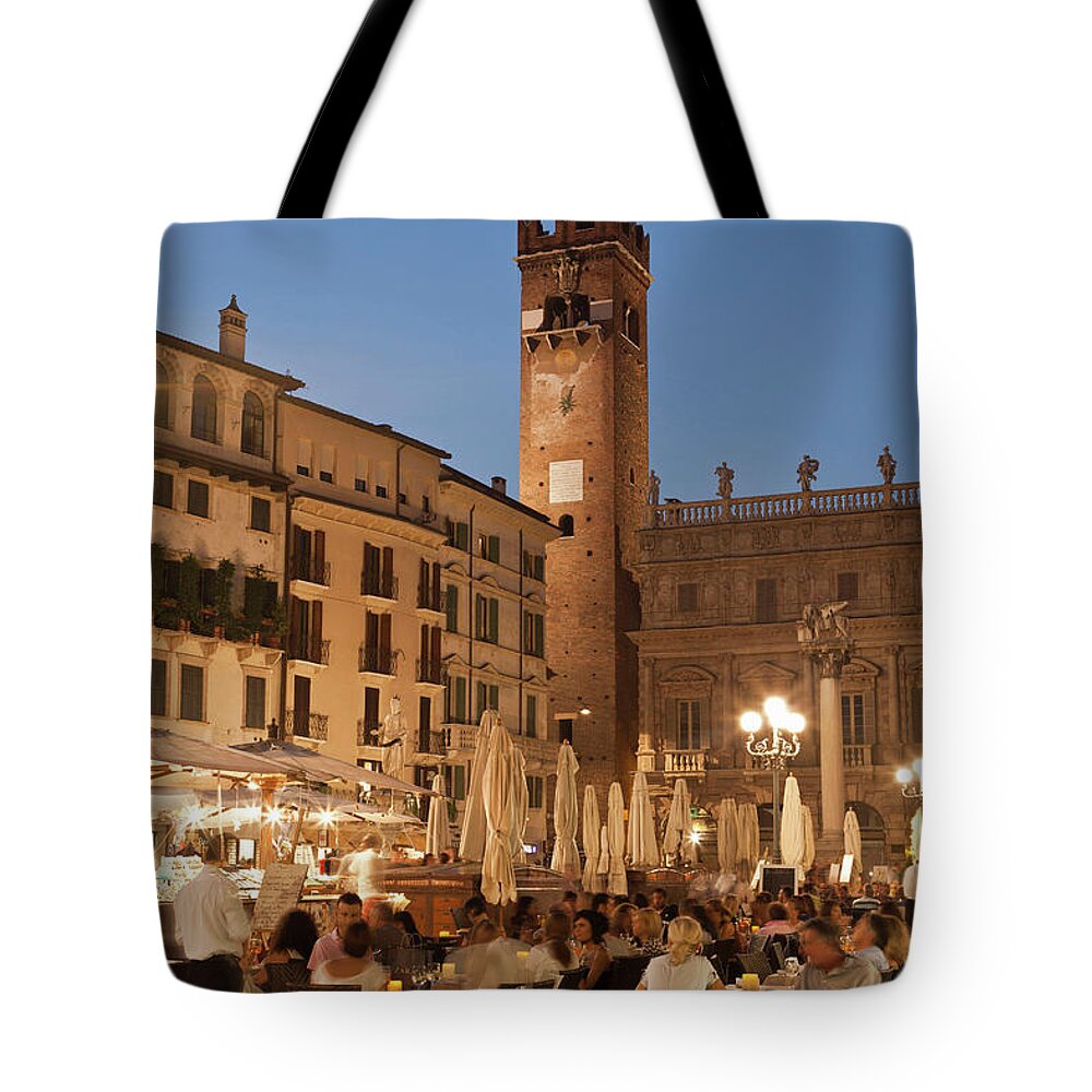 Tranquility Tote Bag featuring the photograph People At Sidewalk Cafe In Town Square by Cultura Rm Exclusive/walter Zerla