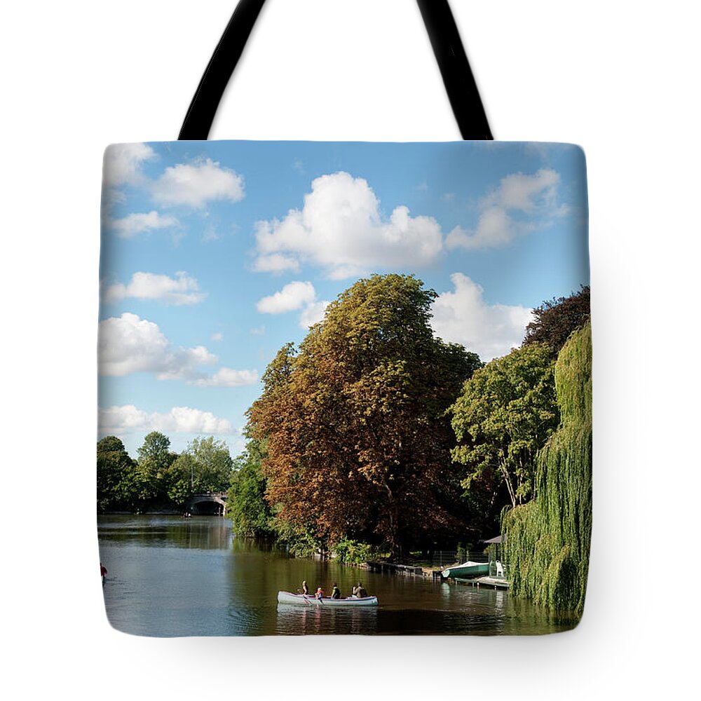 People Tote Bag featuring the photograph People Canoeing On A Channel by Thomas Winz