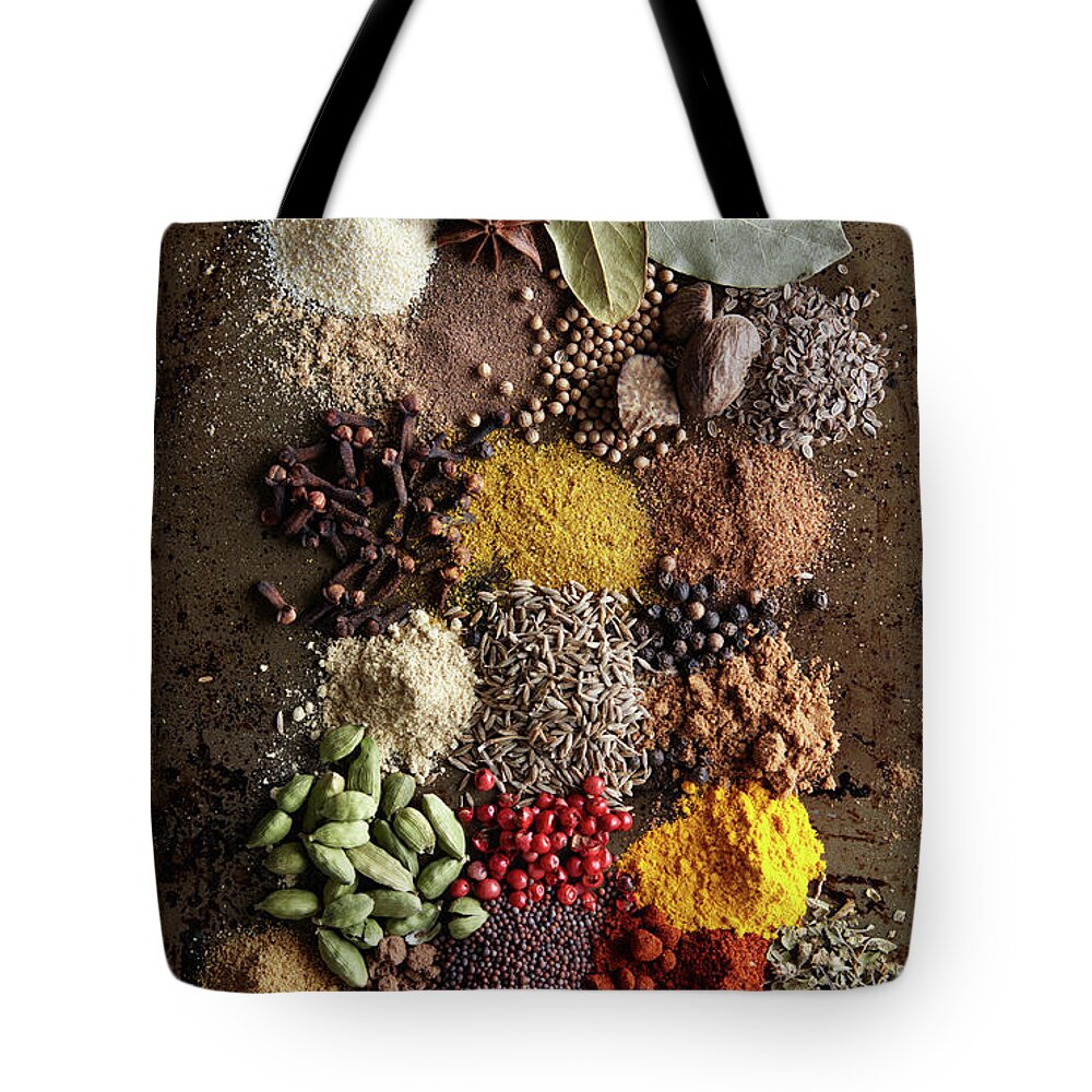 San Francisco Tote Bag featuring the photograph Piles Of Various Spices On Metal Surface by Maren Caruso