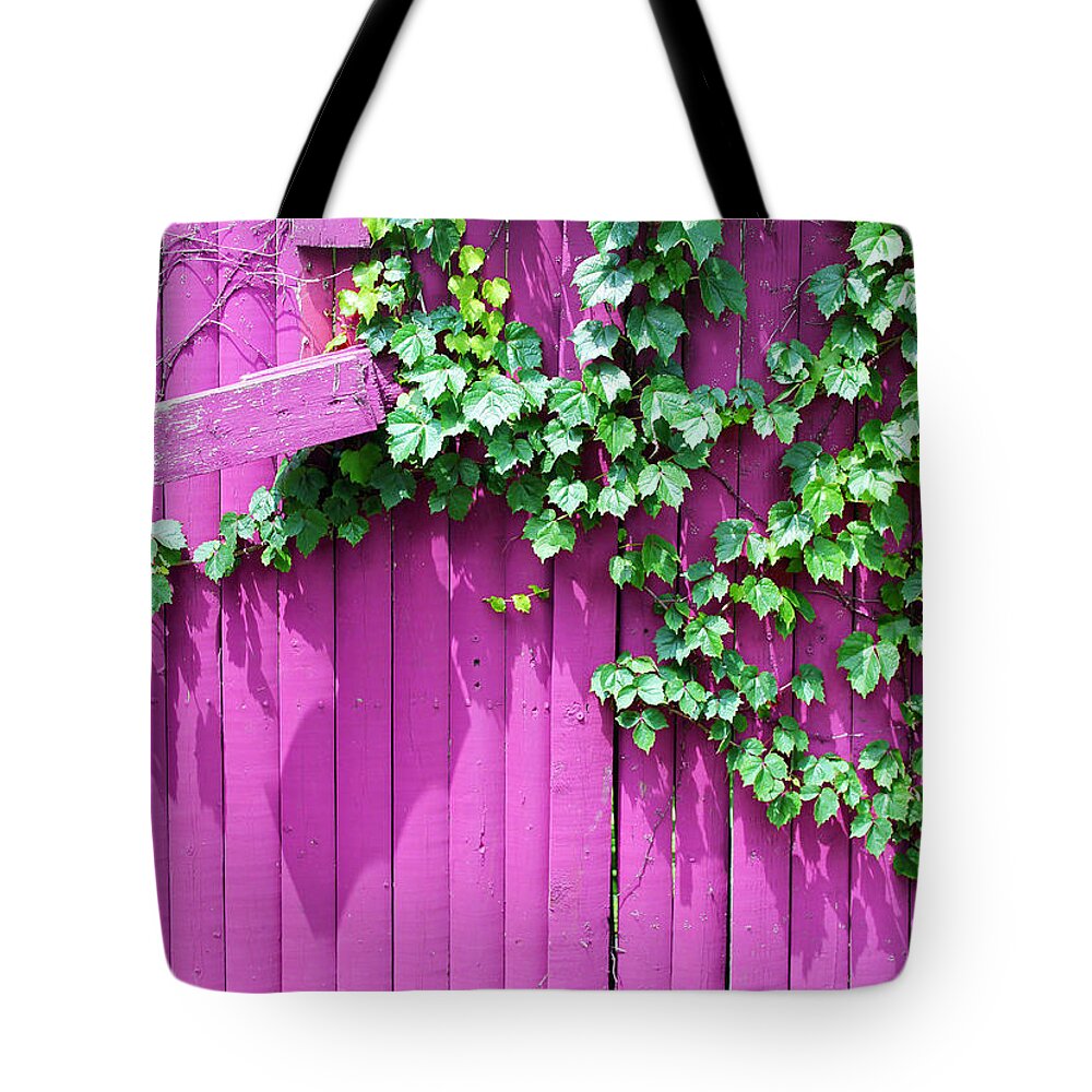 Fence Tote Bag featuring the photograph Pink Fence and Foliage by Mary Bedy