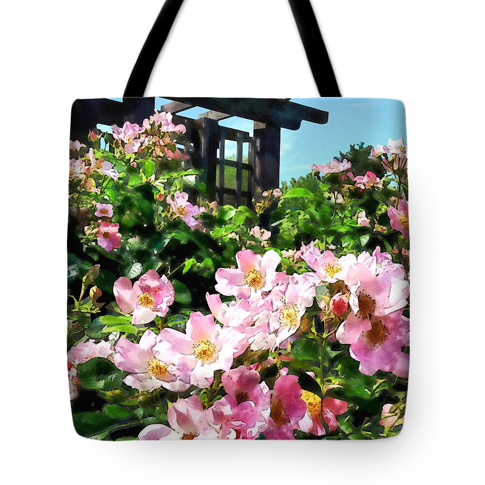 Rose Tote Bag featuring the photograph Pink Roses Near Trellis by Susan Savad