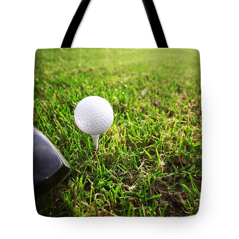 Golf Tote Bag featuring the photograph Playing golf. Club and ball on tee by Michal Bednarek